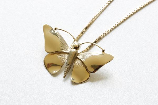 ashanger vlinder goud