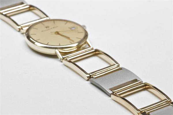 horlogeband van oud goud met titanium
